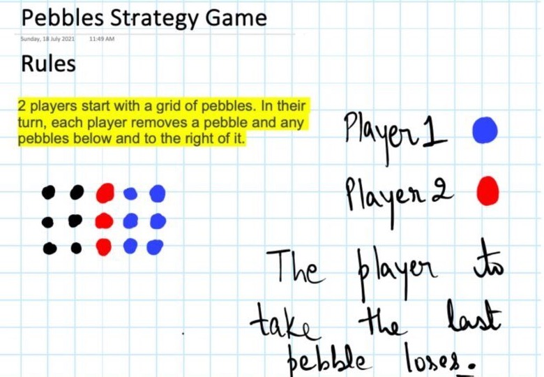 The Pebbles strategy game written up on a whiteboard: two players, and the one who takes the last pebble loses.